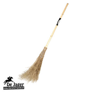 Long wooden-handled straw broom with a bundled brush head; brand watermark 'De Jaer' in the bottom-left corner.