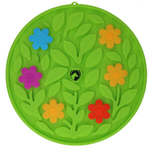 Round green plastic activity disk with a leafy pattern and colorful flowers (blue, pink, orange, yellow, red) scattered among raised leaves; small central logo.